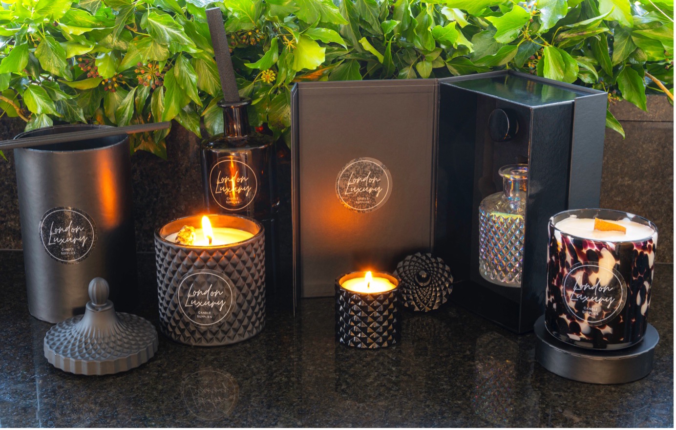 A collection of black, luxury candles.
