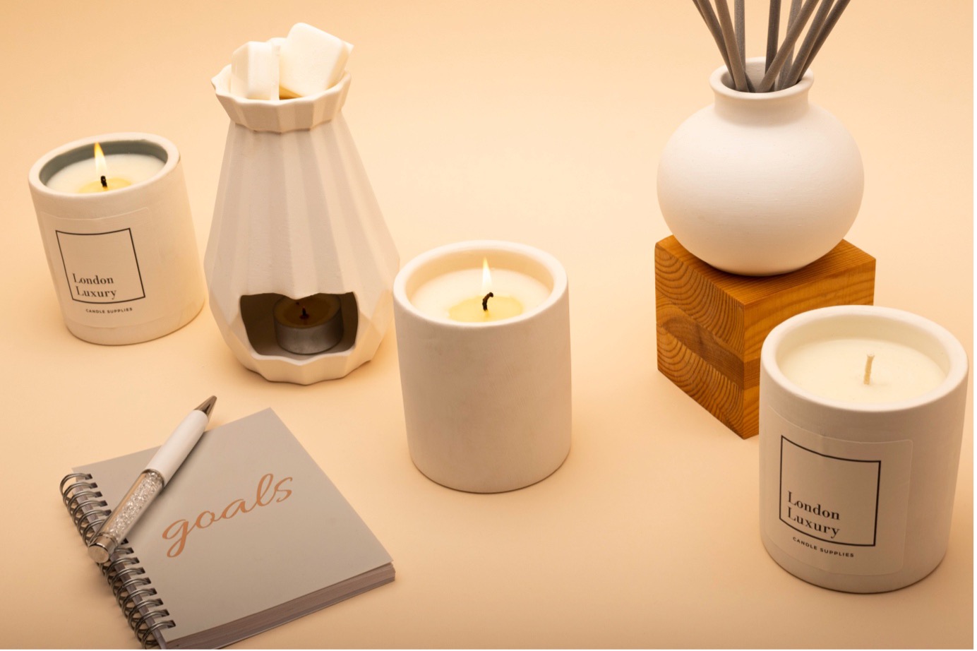 Ceramic range of jars, diffusers and wax melt burners, along with a 'Goals' notebook. 