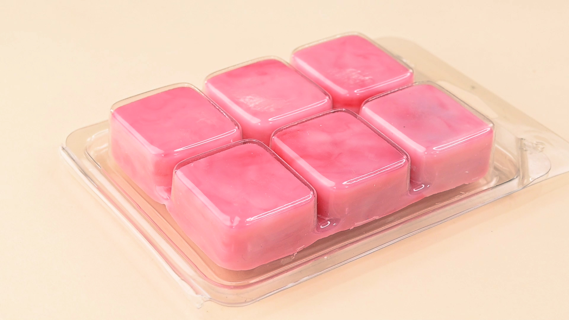 Pink cube wax melts in a clamshell case